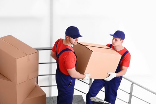 Professional man loading items into a moving van