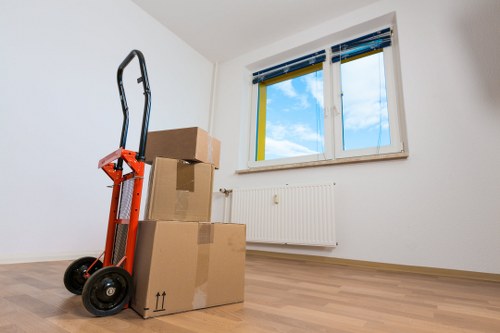 Movers efficiently unpacking items at new location