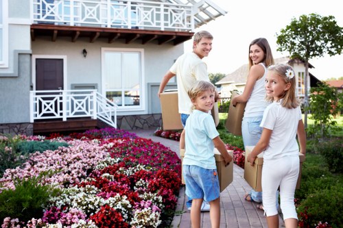 Operator using lifting aids and securing items in van
